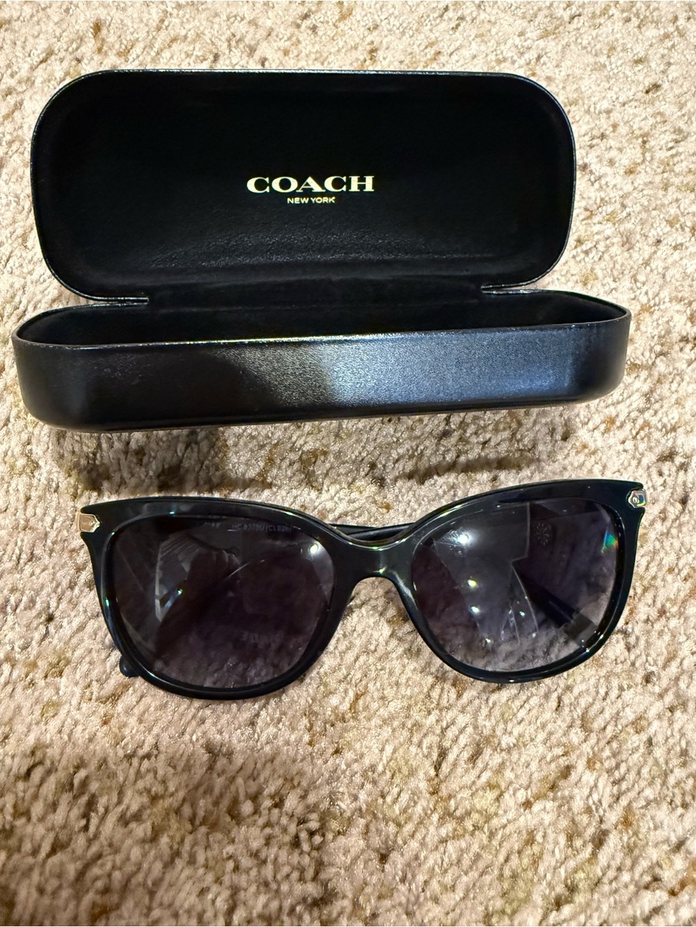 Coach Black Cat-Eye Sunglasses with Gold Temple Accents